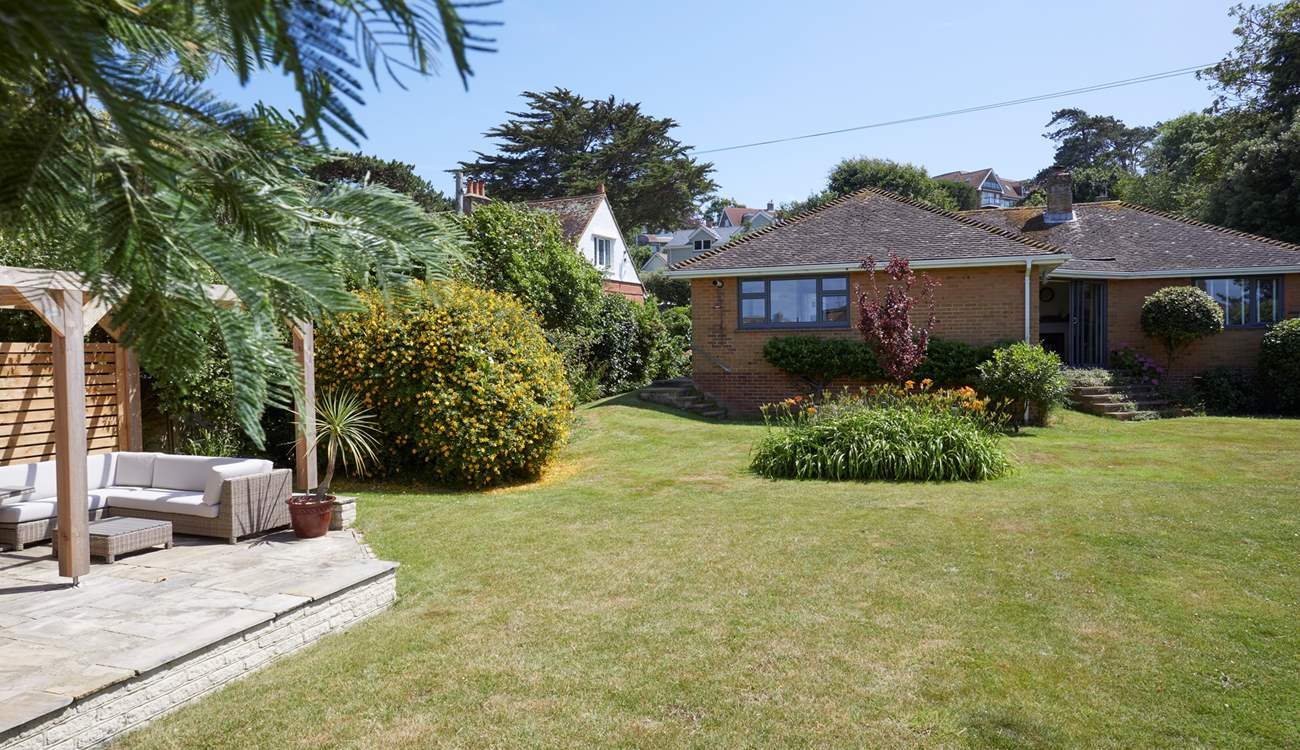 The well-kept garden offers a peaceful oasis. 