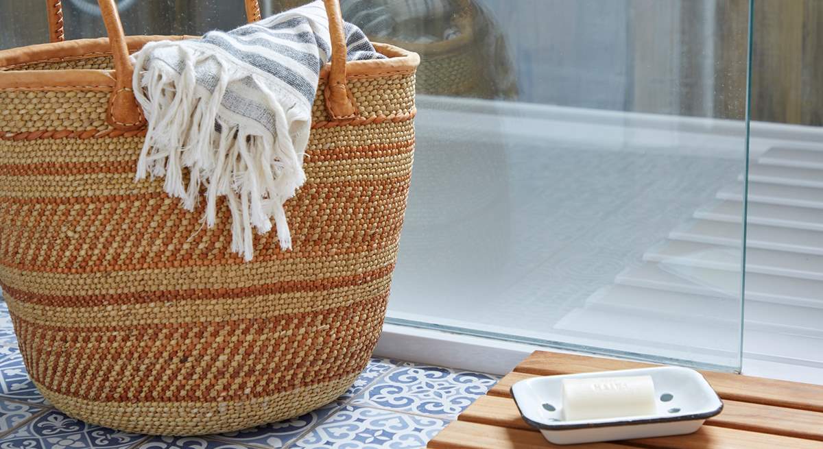 Step into the shower after a day at the nearby beach.