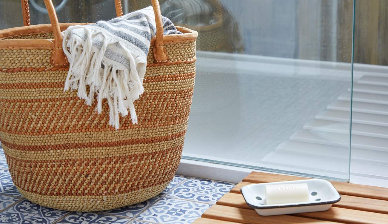Step into the shower after a day at the nearby beach.