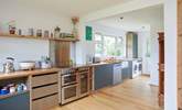 The modern-rustic kitchen offers the perfect blend of practicality and style. - Thumbnail Image