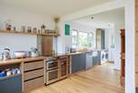 The modern-rustic kitchen offers the perfect blend of practicality and style.