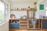 The range oven and thoughtful details make this space a pleasure for the chef!