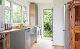 Step out to the fabulous rear garden from the kitchen. - Thumbnail Image