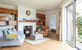 Cosy up by the fire in the delightful snug area. - Thumbnail Image