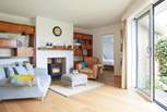 Cosy up by the fire in the delightful snug area.