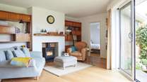 Cosy up by the fire in the delightful snug area.
