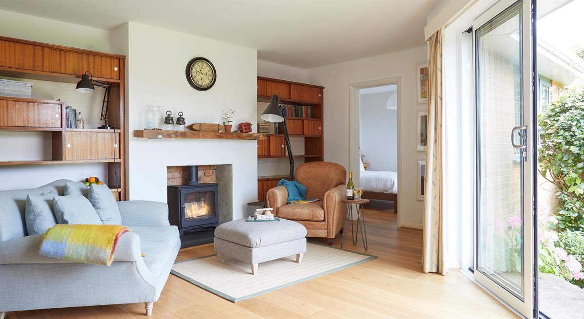 Cosy up by the fire in the delightful snug area.