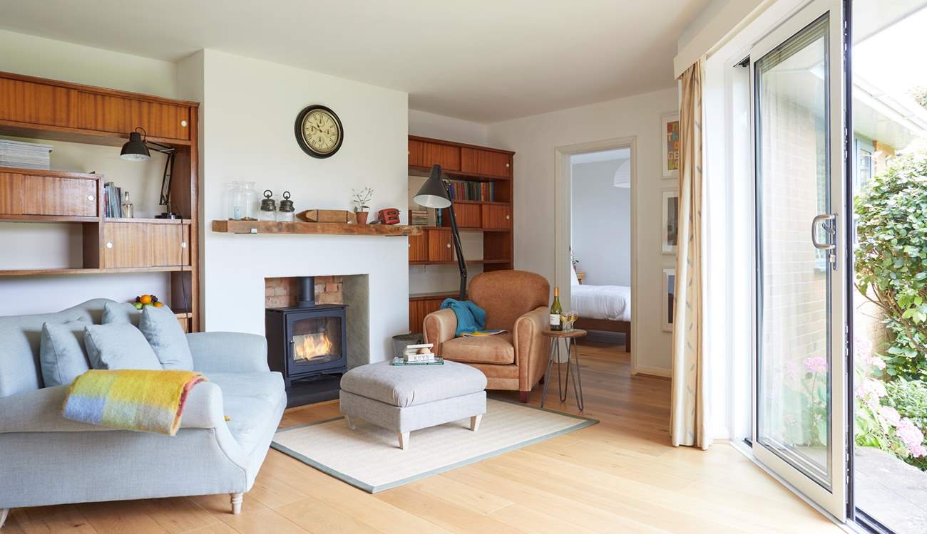 Cosy up by the fire in the delightful snug area.