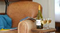Relax and enjoy a little tipple and a good book.