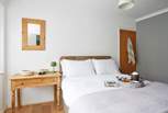 A restful night awaits in bedroom 1. 
