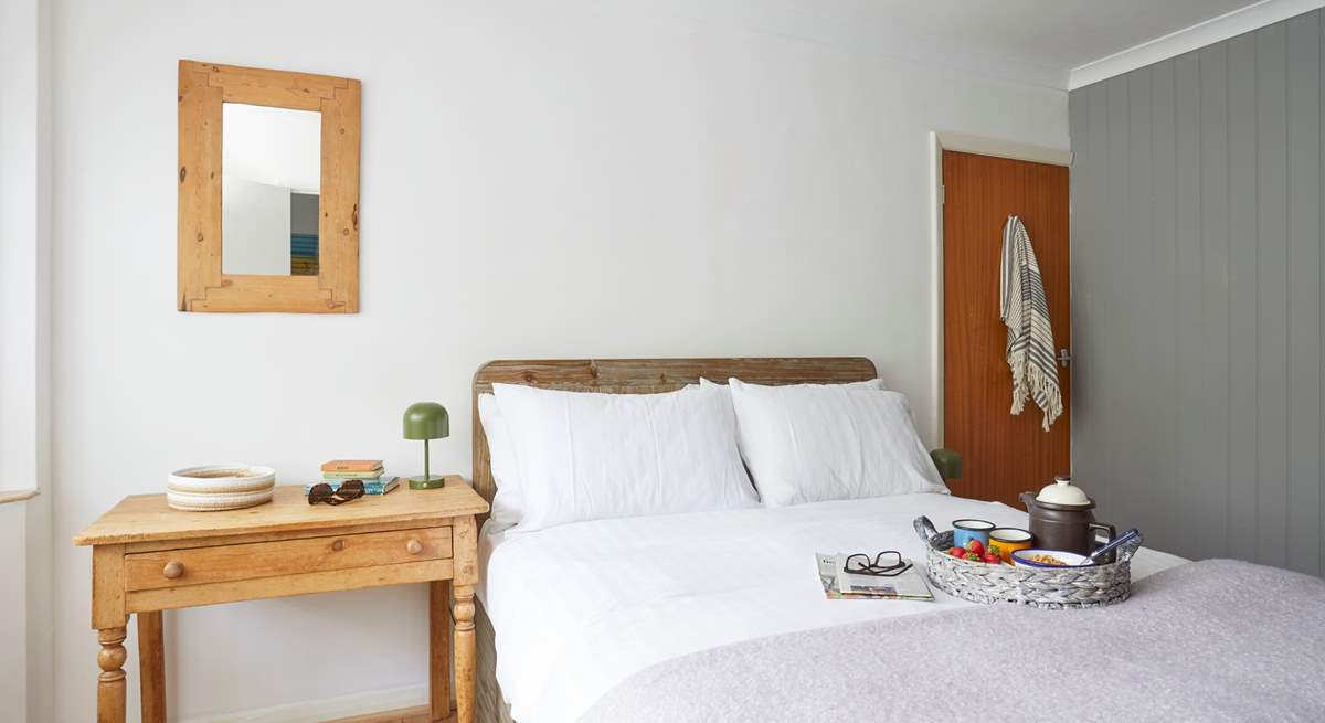 A restful night awaits in bedroom 1. 