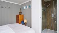 Bedroom 1 boasts a stylish en suite shower-room. 