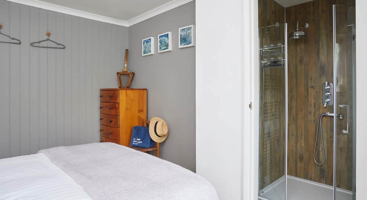 Bedroom 1 boasts a stylish en suite shower-room. 