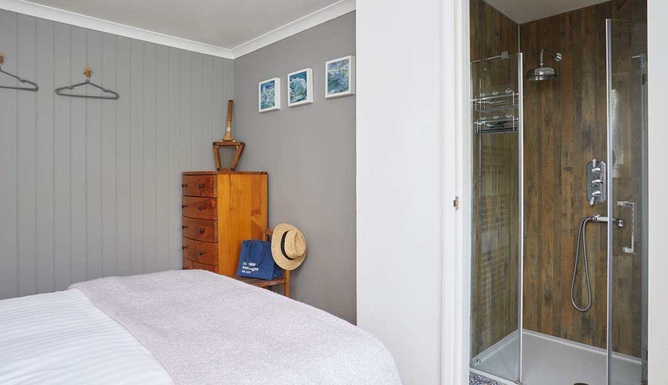 Bedroom 1 boasts a stylish en suite shower-room. 