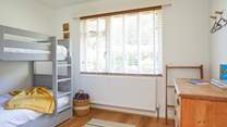 Bedroom 2 with bunk-beds offers a fun space for the children.