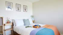A restful double bedroom, tucked away from the living space.