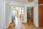 A spacious entrance hall provides a warm welcome. 