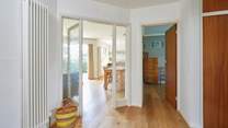 A spacious entrance hall provides a warm welcome. 