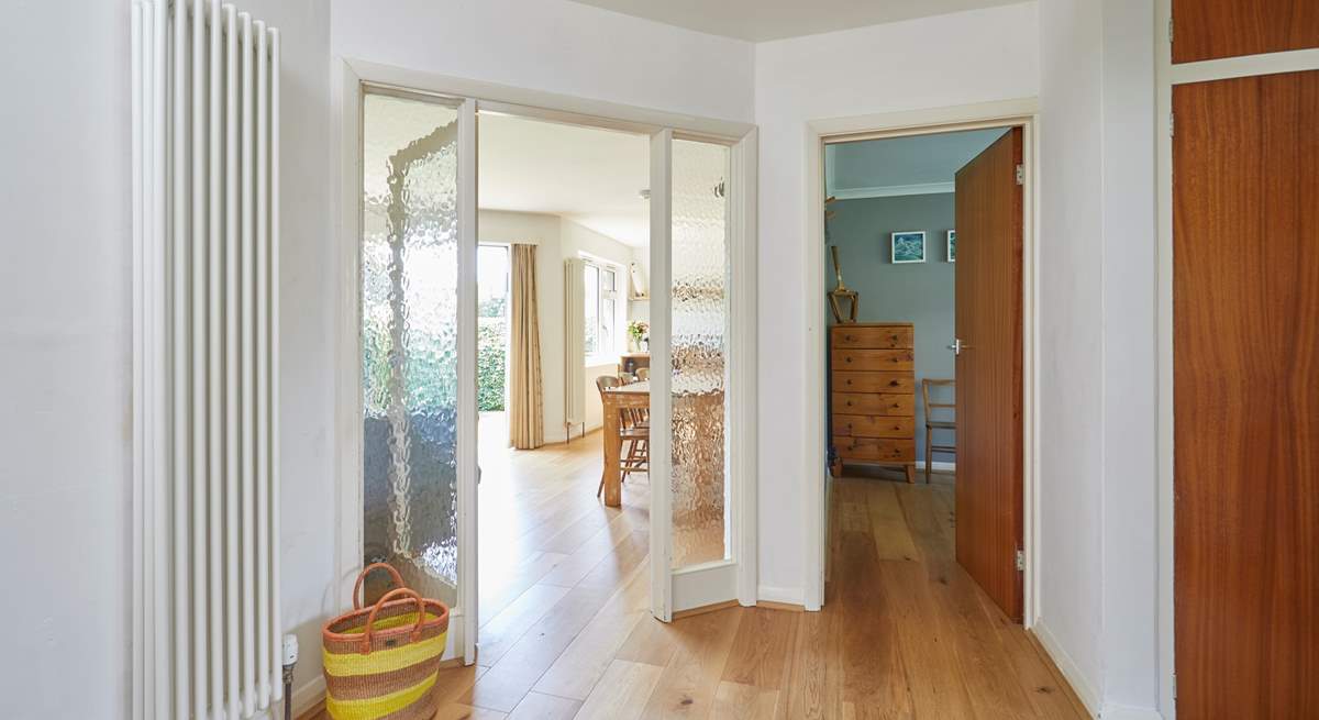 A spacious entrance hall provides a warm welcome. 