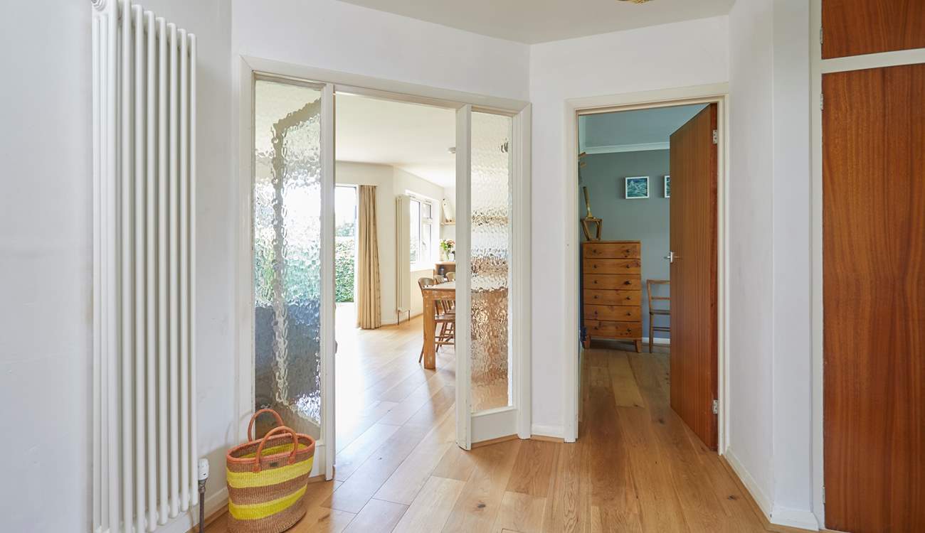 A spacious entrance hall provides a warm welcome. 