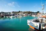Visit the vibrant town of Padstow for a great selection of eclectic shops and eateries.