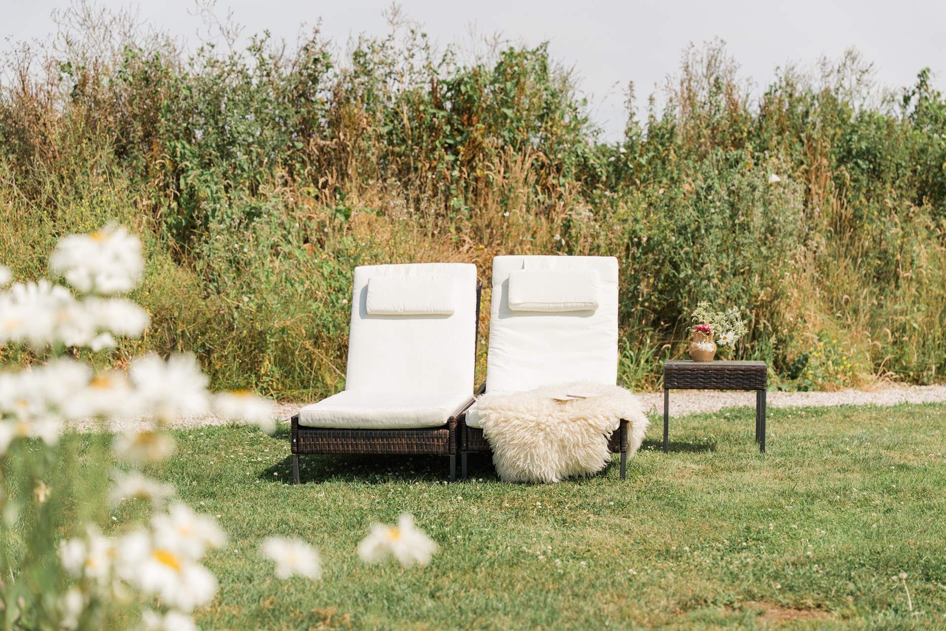 The sun-soaked garden is a haven for slow, al fresco living.