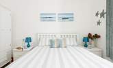 Bedroom 1 features an oceanic palette.  - Thumbnail Image