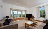 Large windows and soaring ceilings. - Thumbnail Image