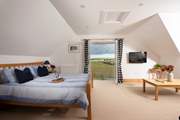 Bedroom 3 is on the first floor and has a Juliet balcony and valley views.