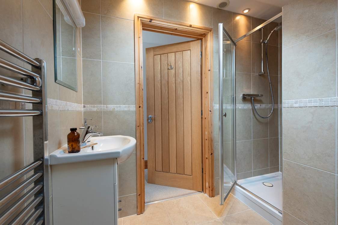 The modern en suite shower-room to bedroom 3.