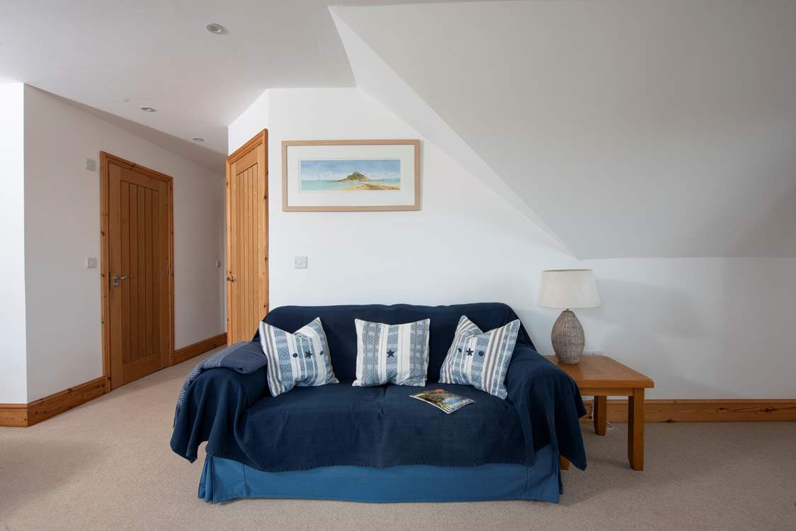 Snuggle up on the sofa in bedroom 4 and catch up on some holiday reading.