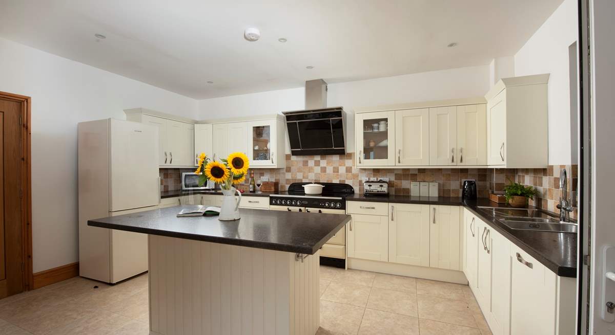 The kitchen is spacious and filled with light.