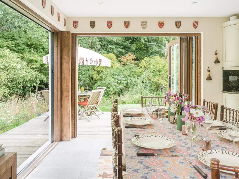 Bi-fold doors open to the deck-area and gorgeous garden.