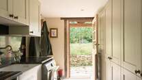 The utility-room with door that leads to the garden, where just outside you will find a useful shower to hose down muddy dogs and wellies.
