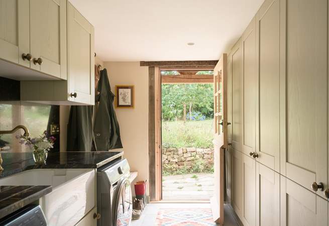 The utility-room with door that leads to the garden, where just outside you will find a useful shower to hose down muddy dogs and wellies.
