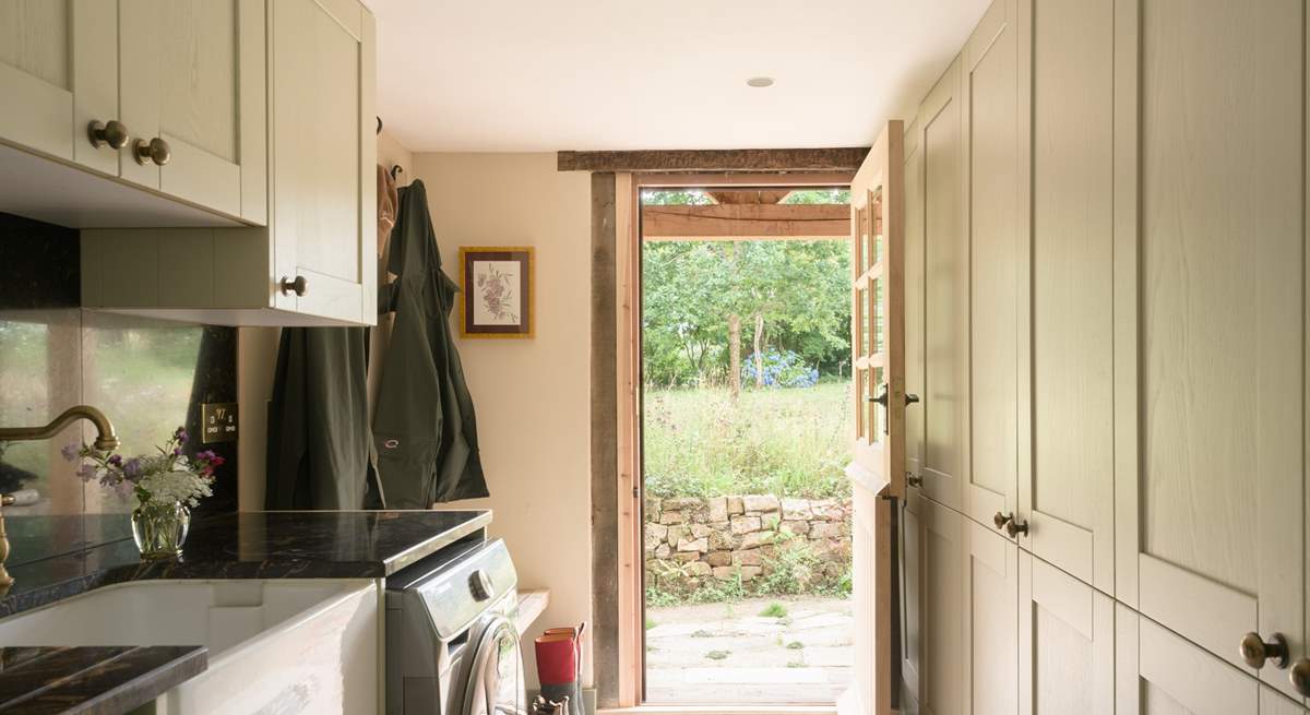 The utility-room with door that leads to the garden, where just outside you will find a useful shower to hose down muddy dogs and wellies.
