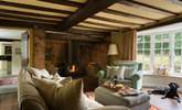 The sitting-room is bursting with character and has an inglenook fireplace with wood-burning stove for those chilly afternoons or evenings. - Thumbnail Image