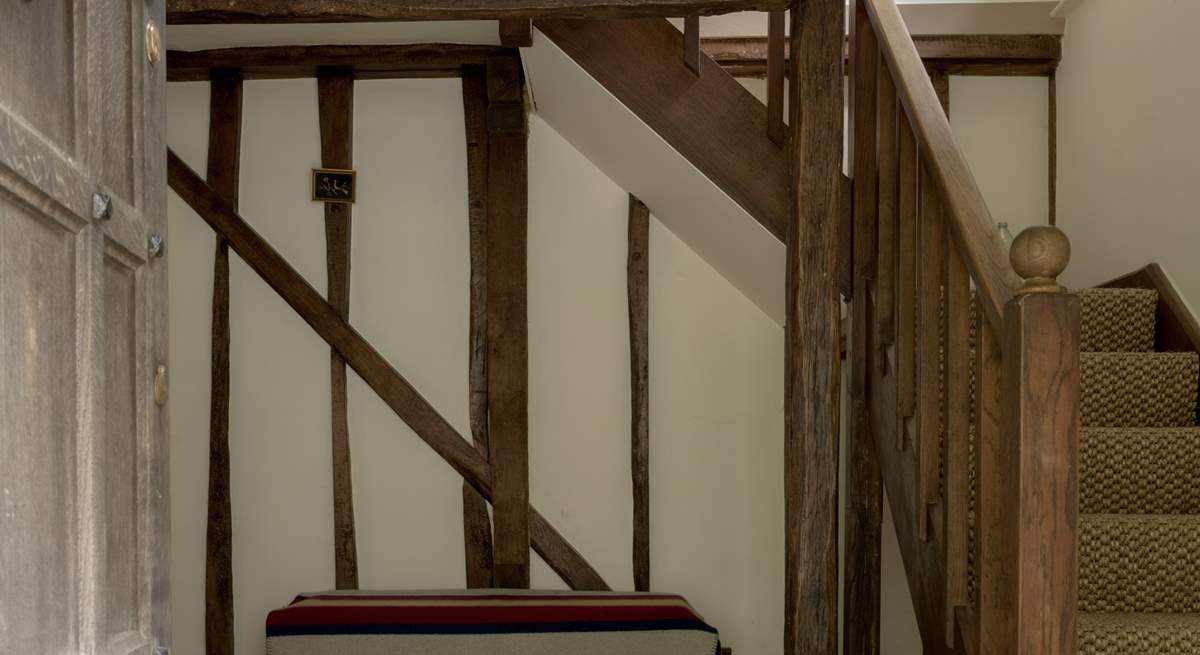 As you step through the main door, you are greeted by this wonderful oak staircase.