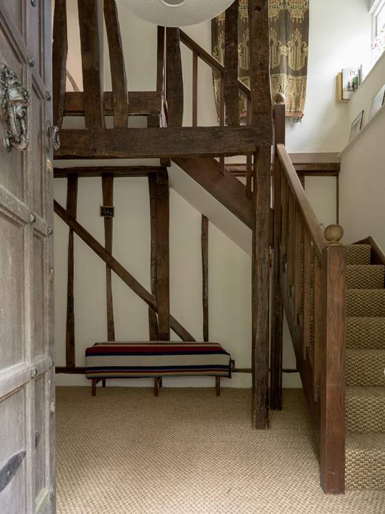 As you step through the main door, you are greeted by this wonderful oak staircase.