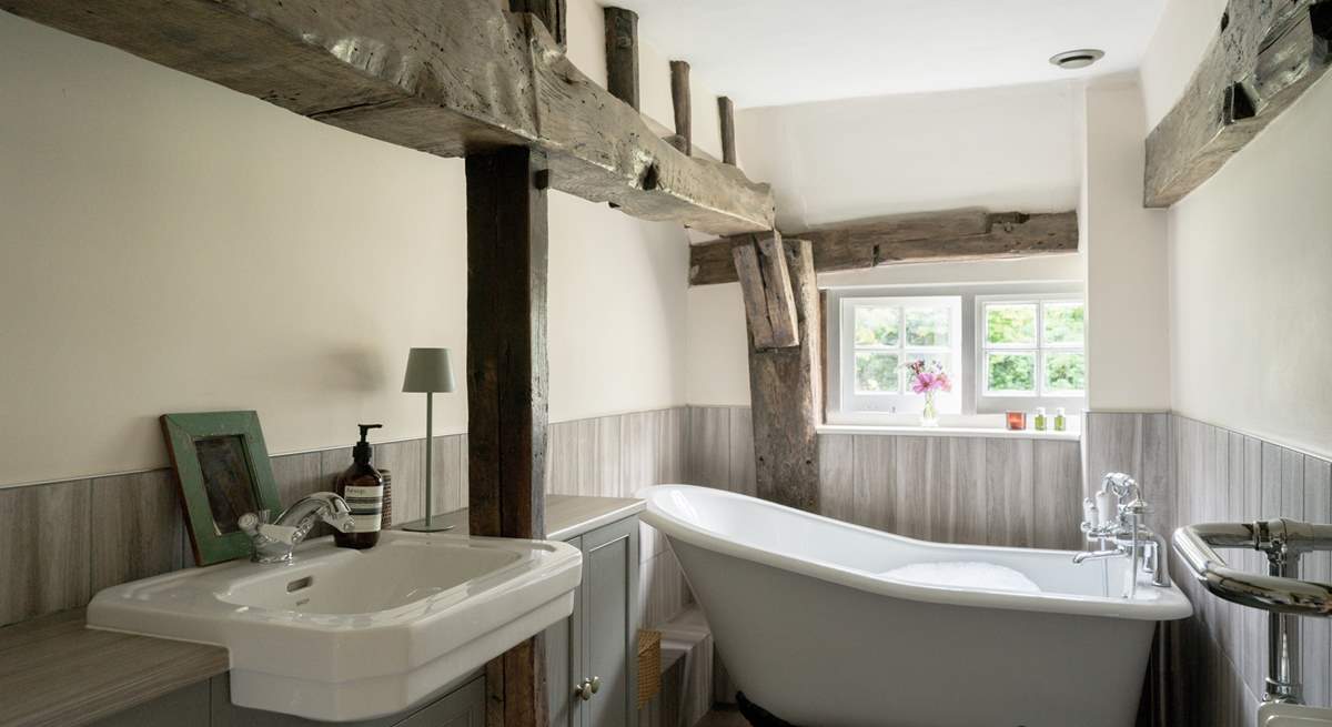 The family bathroom has a beautiful Victorian roll-top bath.