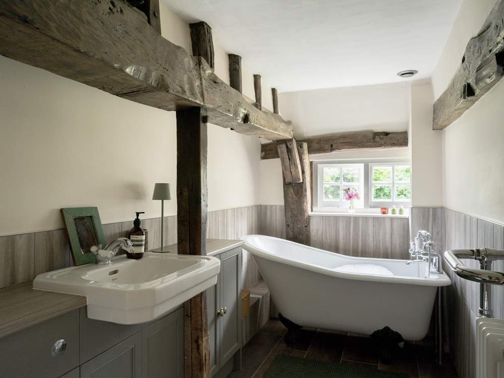 The family bathroom has a beautiful Victorian roll-top bath.