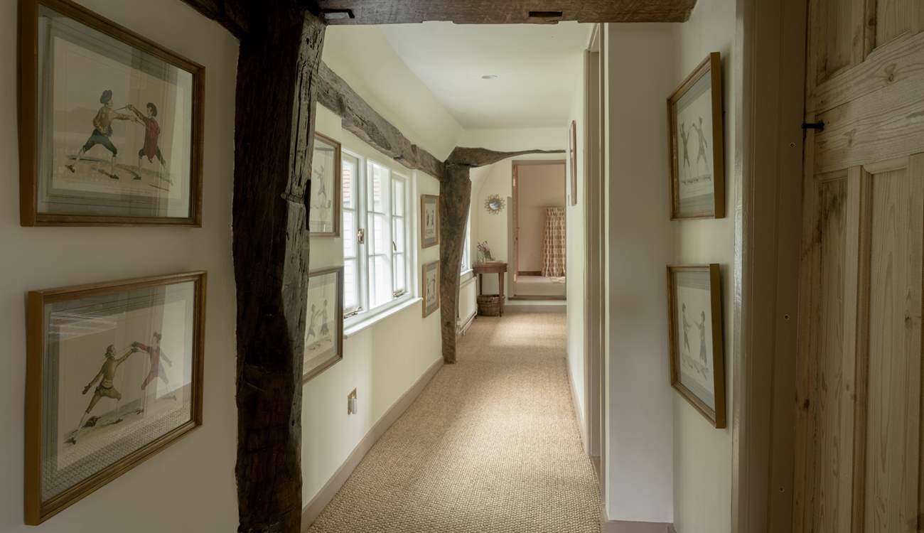 Please note there are a couple of the beams upstairs along the hallway that are a little low.