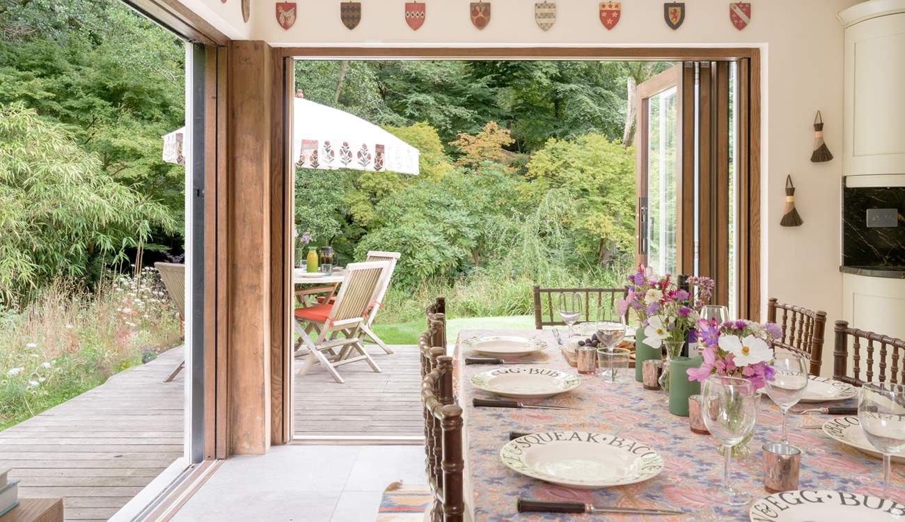 Bi-fold doors open to the deck-area and gorgeous garden.