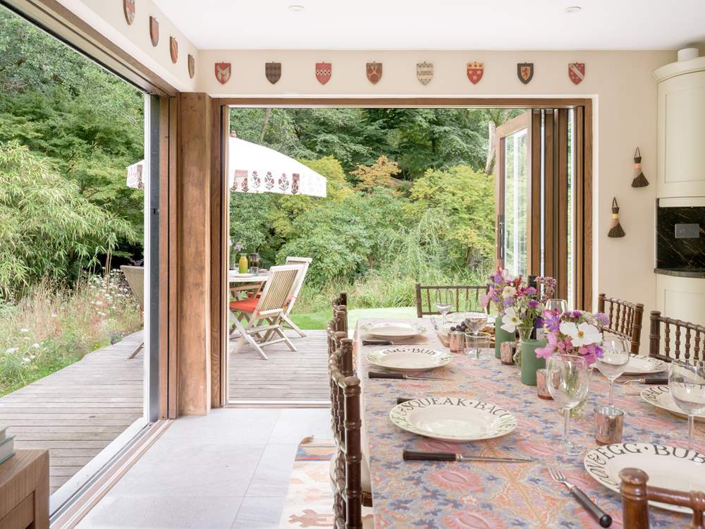 Bi-fold doors open to the deck-area and gorgeous garden.
