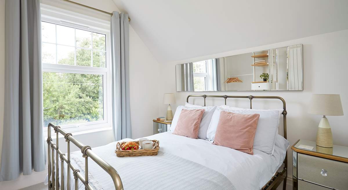 Bedroom 1 is located at the rear of the property and overlooks the courtyard.