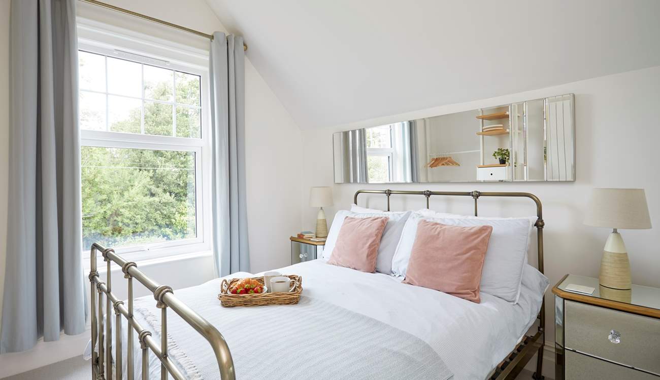 Bedroom 1 is located at the rear of the property and overlooks the courtyard.