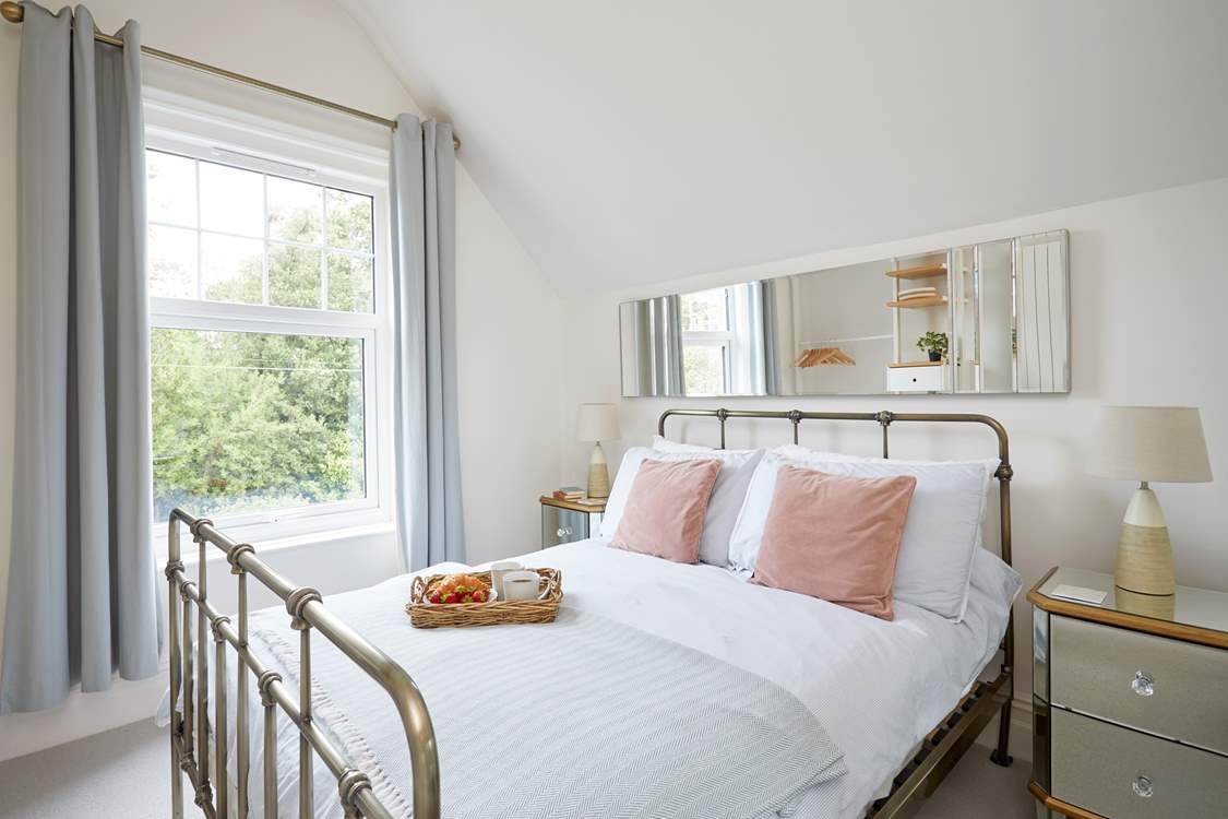 Bedroom 1 is located at the rear of the property and overlooks the courtyard.