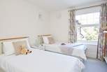 Bedroom 2 is a stylish twin bedroom...