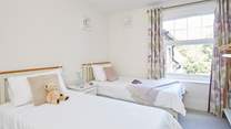 Bedroom 2 is a stylish twin bedroom...