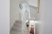 The first floor has a split level with three steps.